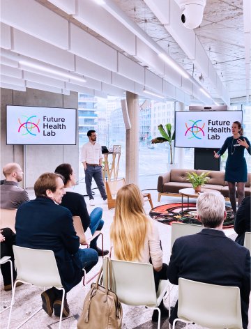 Future Health Lab team presenting innovative healthcare solutions to an engaged audience, with active participation from Sclable.